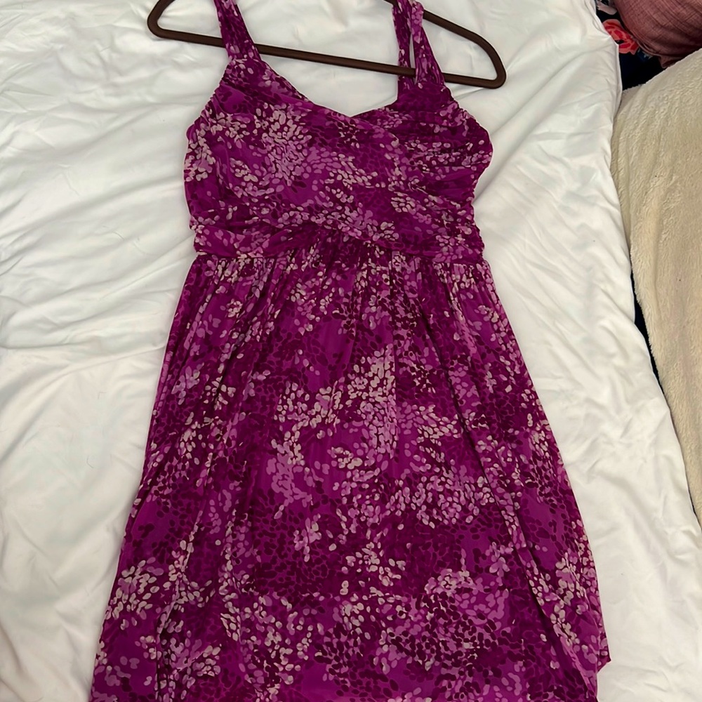 Semi formal dress in a pretty magenta color. Ruching on the top. Size 8 petite
